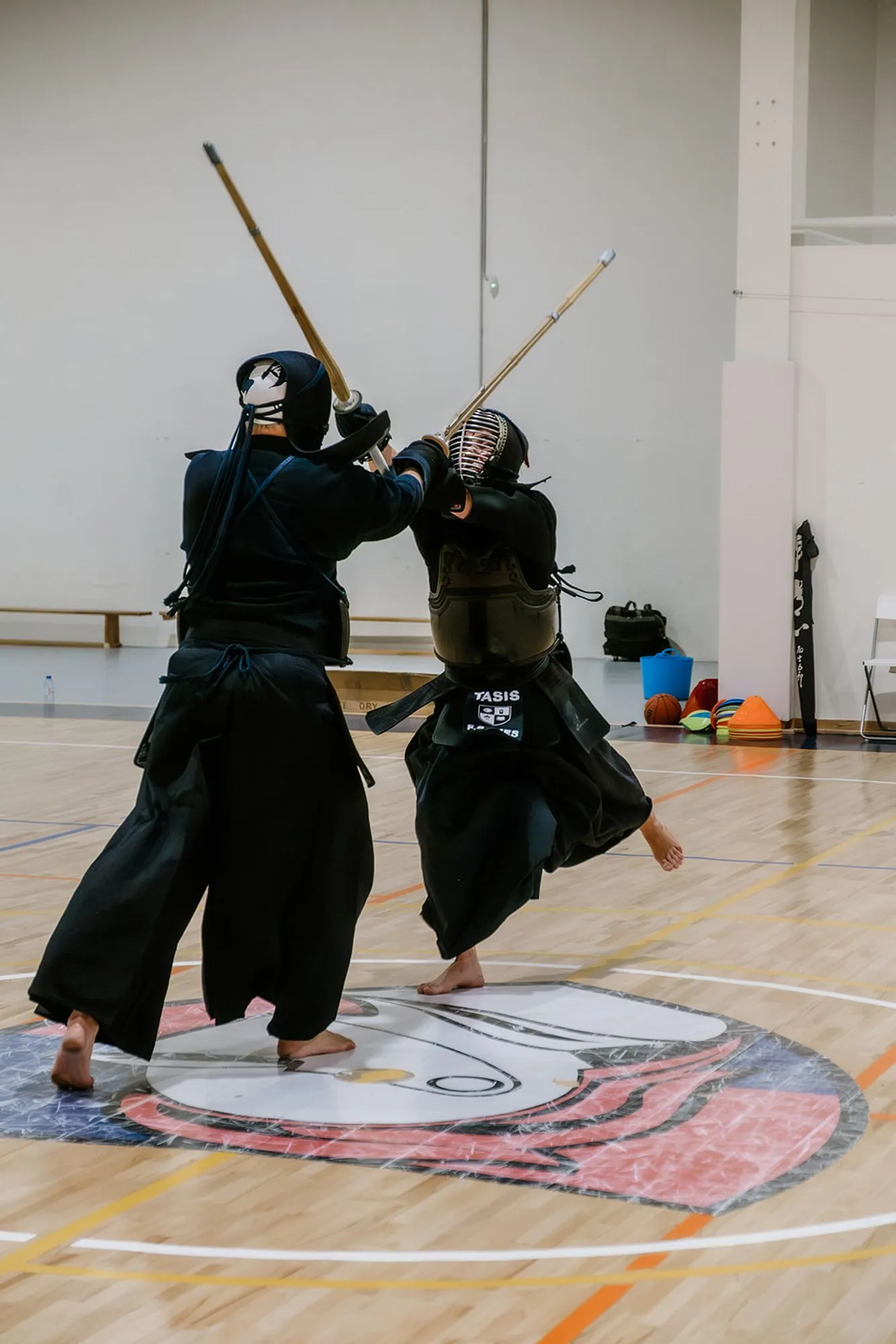 Close combat between two kendoka, one striking